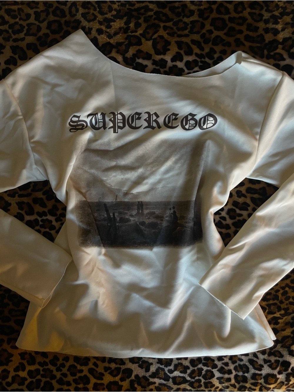 Crème 'SUPEREGO' Graphic Off Shoulder Long Sleeve Top